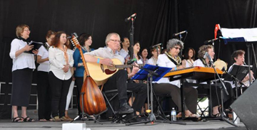 VTC at the European Festival. From left, first row: Mark Hamilton (guitar), Laura Blumenthal (santouri), Erika Gerson (tambourine), Kate Gerson (clarinet); 2nd row: Yeshare Sonay, Bahar Çınarlı, Özge Göktepe, Tulen Çankaya, Ayşegül Doğar; 3rd row: Sema Kutay Aydede, Şenkal Öztürkler, Ali Ergüdenler, Sapideh Salimi.